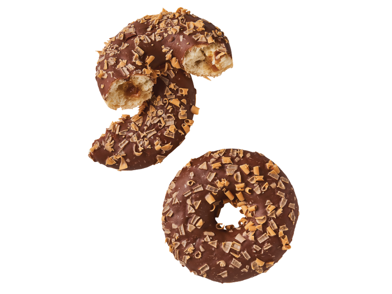 Två chokladdunkar med karamellbitar, en biten och fylld med karamell.