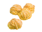 Fyra sockrade, gyllene bullar med spiralmönster på svart bakgrund.