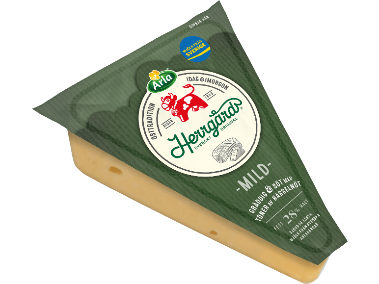 En bit mild, krämig ost med toner av hasselnöt, förpackad i en grön förpackning.