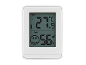 Vit digital termometer och hygrometer med LCD-skärm, visar 27.9°C och 56% luftfuktighet.