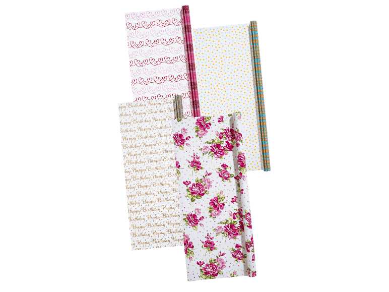 Fyra rullar presentpapper med olika mönster, inklusive hjärtan, prickar och blommor.