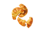 Gyllene salta croissanter med örter, en bruten på mitten, mot svart bakgrund.