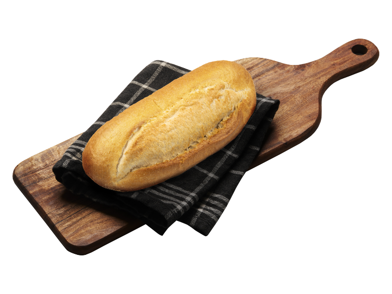 Färskt bröd på en träskärbräda med en svart duk