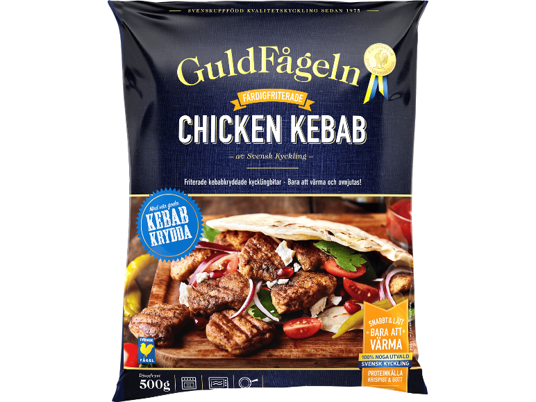 Förpackning med friterad kycklingkebab med kryddor, redo att värmas och serveras.