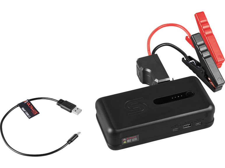Svart bärbar batteristartare med röda och svarta startkablar och en USB-laddningskabel.