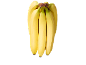 En klase mogna gula bananer med gröna stjälkar mot en svart bakgrund.
