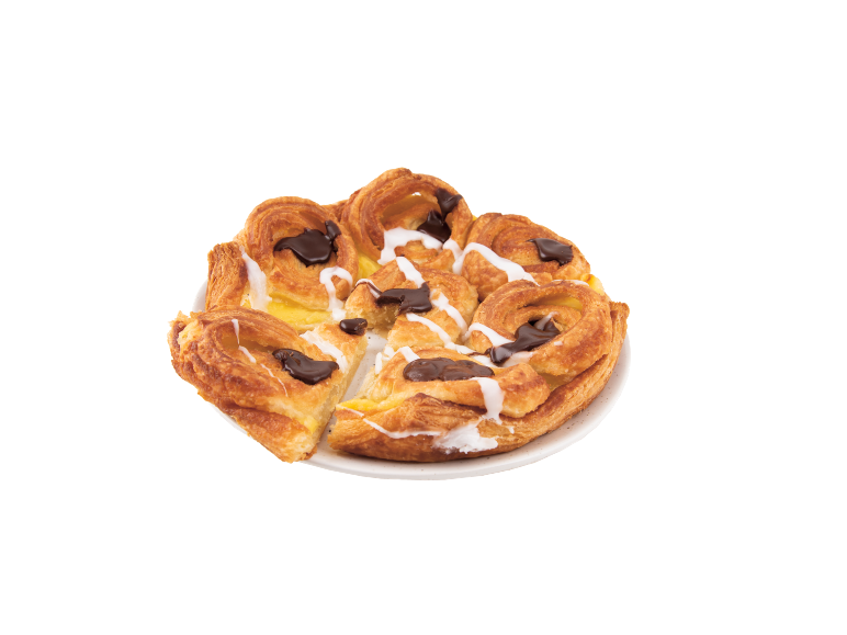 Rund dansk bakelse med vaniljkräm, choklad och vit glasyr på en tallrik.