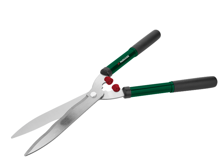 Trädgårdshäcksax med gröna handtag och svarta grepp.