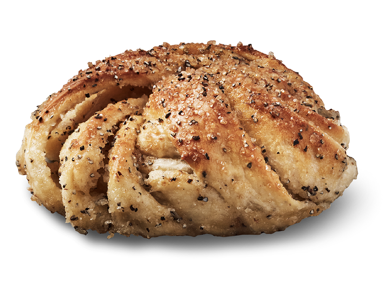 Flätat sött bröd med socker och svartpeppar.