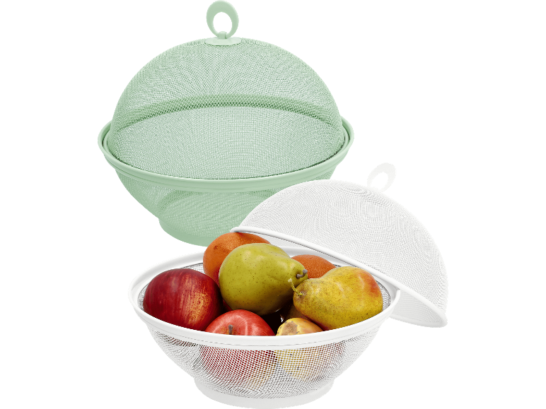 Fruktkorgar i metallnät: en grön tom, en vit fylld med frukt.