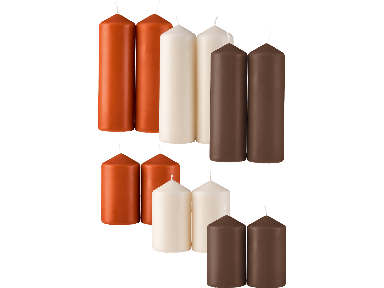 Pelarljus i tre färger: orange, gräddvit och brun, arrangerade i grupper.