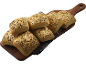 Fullkornsbröd med sesam- och linfrön på en träskärbräda.