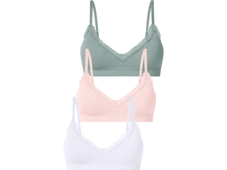 Tre ribbade braletter med spetskant: grön, rosa och vit.