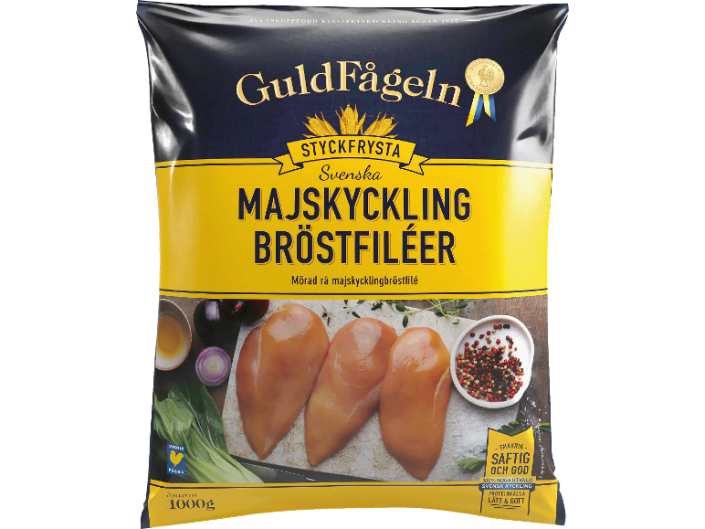 Förpackning med frysta majskycklingbröstfiléer med kryddor och grönsaker.