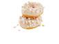 Två glaserade munkar med färgglada minimarshmallows, staplade på varandra.