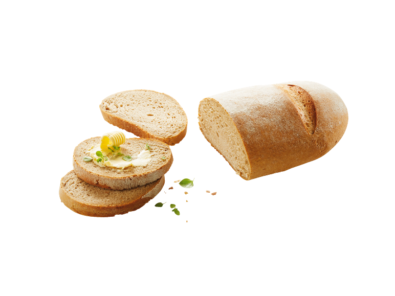 Skivat bröd med smör och örter, bredvid ett bröd.