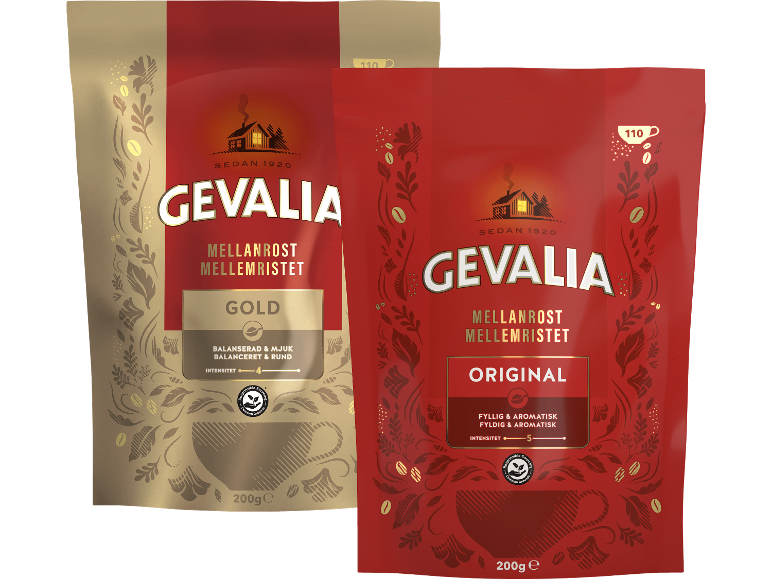 Två förpackningar mellanrostat kaffe, en guld och en röd, med kaffebönsdesigner.