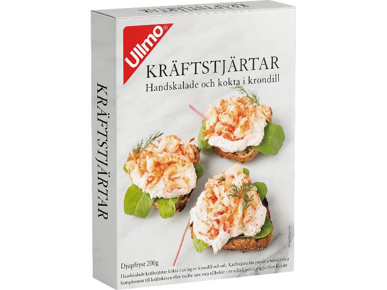 Frysta kräftstjärtar i krondillslag, serverade på smörgåsar.