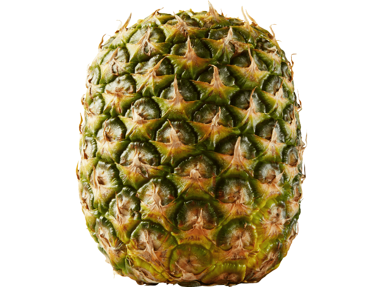 Ananas med grönt och brunt skal mot svart bakgrund.