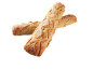 Två krispiga brödbaguetter med mjöl, korslagda på svart bakgrund.