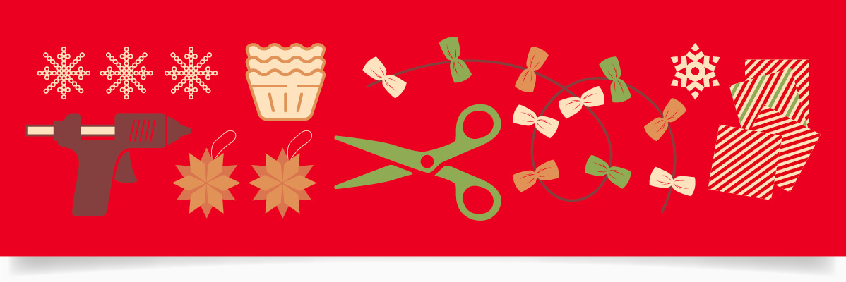 Julklappstillbehör: limpistol, dekorationer, sax och presentpapper.