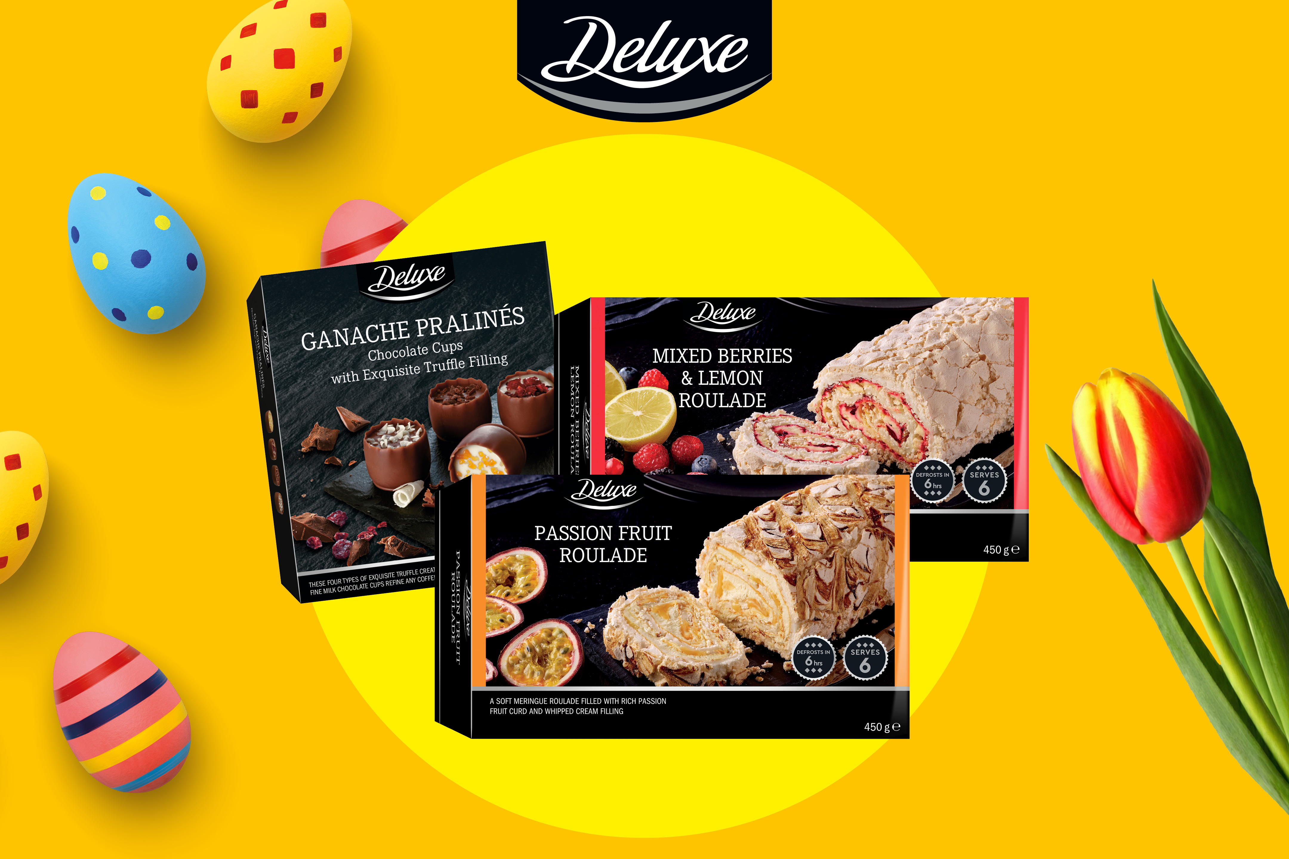 Chokladpraliner och marängroulader med påskägg och tulpaner, för en festlig påsk.